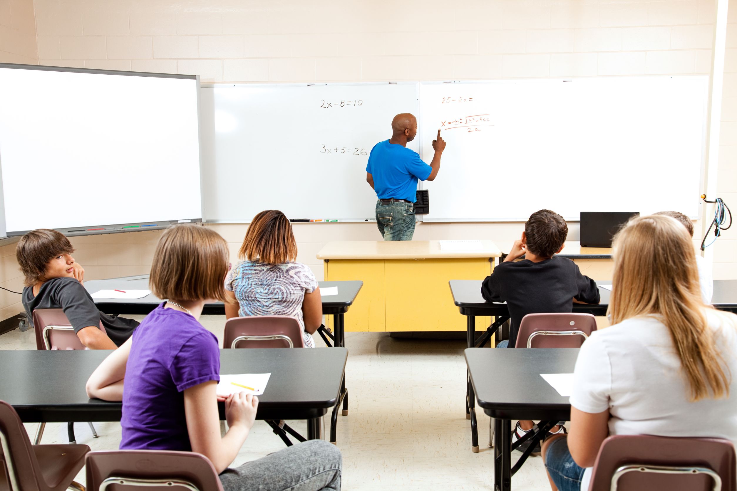 18351342_l-African-american-male-teacher-teaches-a-diverse-high-school-math-classroom