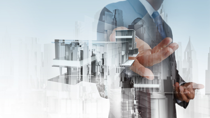 businessman hand presents house model on modern computer as deve